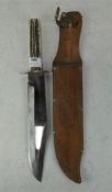 A large Baum hunting knife, in sheath,