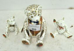 Three Royal Crown Derby figures of bears, the largest with silver stopper,