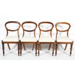 A set of four rosewood effect balloon back dining chairs, with drop in seats,