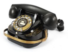 A vintage Bell (Belgium) Telephone Company telephone, with brass dial,