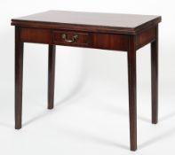 A Georgian style mahogany fold out tea table, the rectangular top on moulded legs,