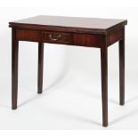 A Georgian style mahogany fold out tea table, the rectangular top on moulded legs,