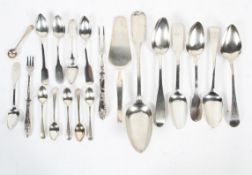 A parcel of silver, silver plate and white metal spoons,