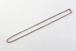 A yellow metal 17 inch abstract link chain, push in clasp. Stamped 9C for 9ct gold.