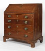 A Georgian oak bureau, the fall front enclosing a fitted interior above four long drawers,