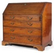 A George III mahogany bureau, the fall front revealing interior fitted with pigeonholes,
