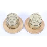 Two brass hub caps mounted as paperweights, by J Bingham, Builder, Long Sutton,