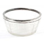 An Edwardian silver-mounted cut glass bowl, panel cut and cut with linear bands,