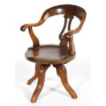 A Victorian walnut Captain's chair, with lyre-shaped splat, with scroll handles,