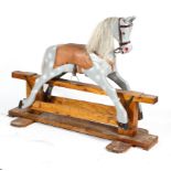 A vintage wooden rocking horse, mid-20th century, painted in grey,