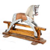 A vintage wooden rocking horse, mid-20th century, painted in grey,