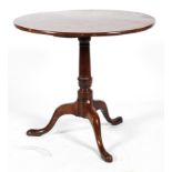 A George III mahogany tilt-top tea table, on column support on tripod legs, on pad feet,