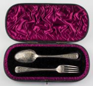 A Victorian silver engraved presentation spoon and fork in purple velvet lined case,