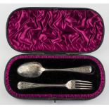 A Victorian silver engraved presentation spoon and fork in purple velvet lined case,