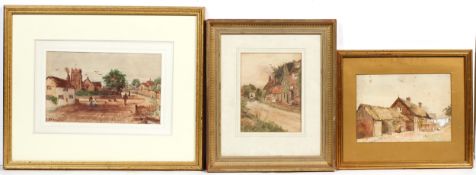 F W Waugh, Figures on a village street before a church, signed lower left,