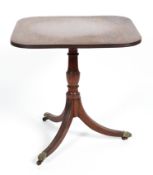 A Regency mahogany tilt top tea table, with reeded splayed legs and baluster stem,