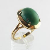 A yellow metal ring with green cabochon. No hallmark - stamped 750. Size M