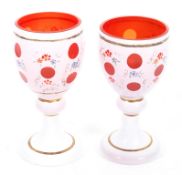Two Bohemian mid-19th century style cased glass goblets, 20th century,