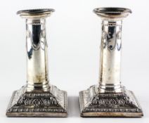 A pair of Edward VII silver candlesticks,