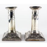 A pair of Edward VII silver candlesticks,