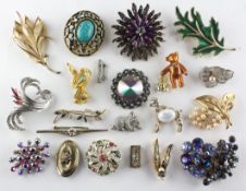 A collection of twenty one costume brooches of variable designs.