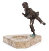 A bronze figure of a boy, mounted on a stone Art Deco style base,