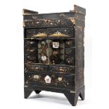 A Chinese black lacquered miniature chest, early 20th century gilt with flower and cranes,