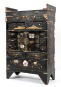 A Chinese black lacquered miniature chest, early 20th century gilt with flower and cranes,