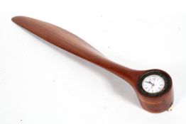 A wooden propeller blade from a WWI Avro 504 Bi-plane, fitted with a Roberts clock,
