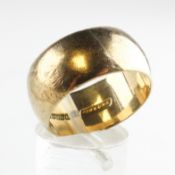 A yellow metal 10.5mm D shape wedding ring. Hallmarked 9ct gold, Birmingham.