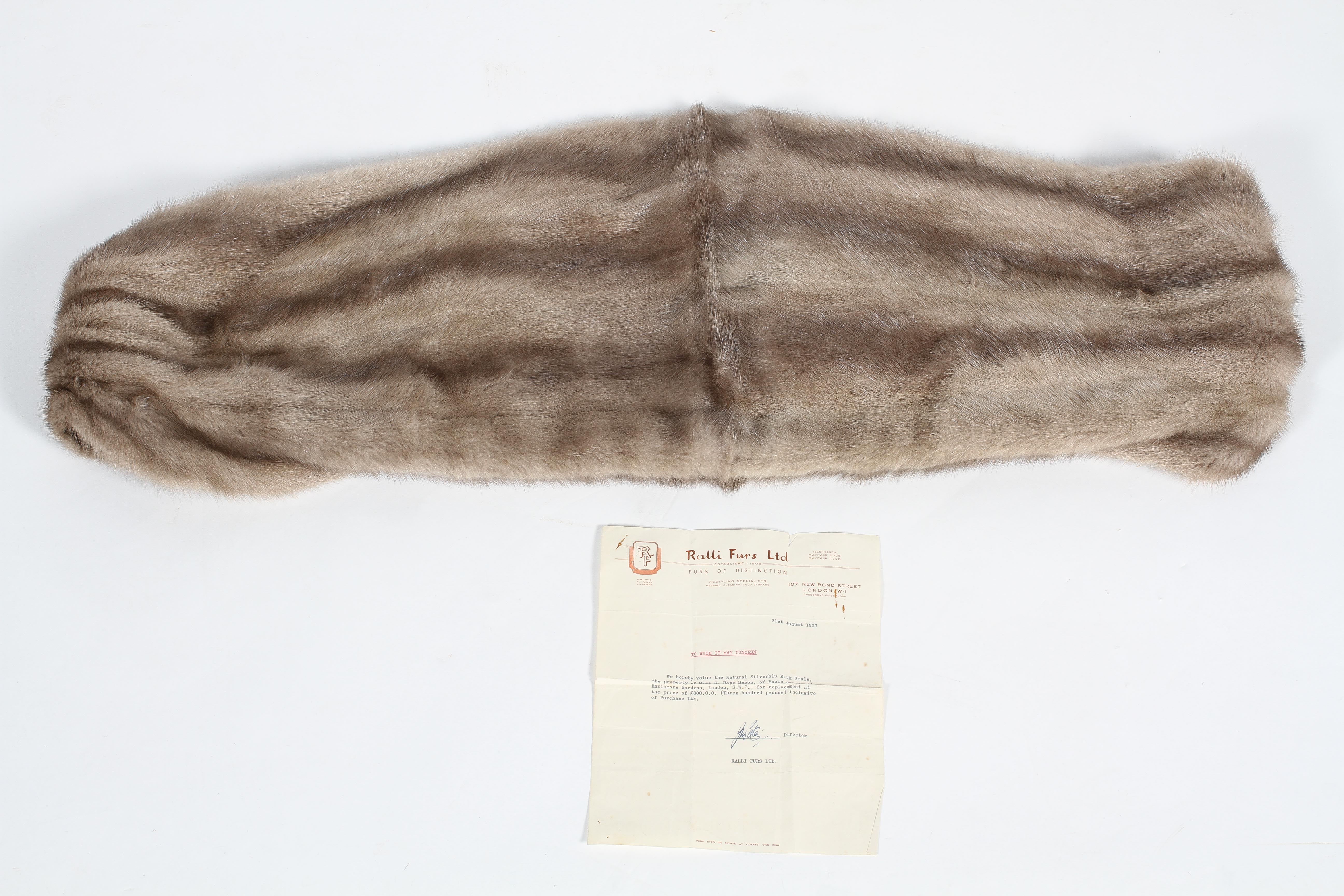 A vintage mink stole with silver silk lining, with zip fastening,