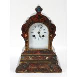19th century French simulated boulle work striking mantle clock, with ebonised scroll-shaped case,