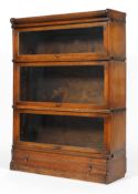 A Globe Wernicke oak bookcase, circa 1900, with three glazed sections above a drawer,