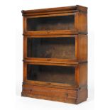 A Globe Wernicke oak bookcase, circa 1900, with three glazed sections above a drawer,