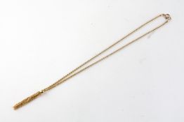 A yellow metal 18 inch rope necklace having a centrepiece tassel design.