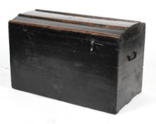 A 19th century ebonised domed top travelling trunk, the top with coopering,