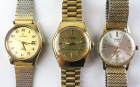 A collection of three gold plated manual wind bracelet wristwatches