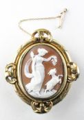 A yellow metal carved cameo brooch with mourning section to reverse having hair enclosed.