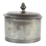 A Georgian pewter tea caddy of oval form, with original press to interior,