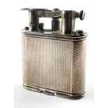 A vintage Dunhill lighter, adorned with engine turned decoration, pat no 288806,