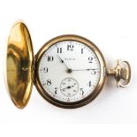 A gold plated Elgin full hunter pocket watch with abstract engraved case.