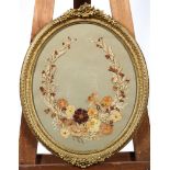 A Victorian style pressed dried flower oval picture, in giltwood frame,