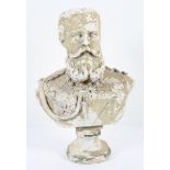 A plaster bust of a Kaiser, with flaking paint,