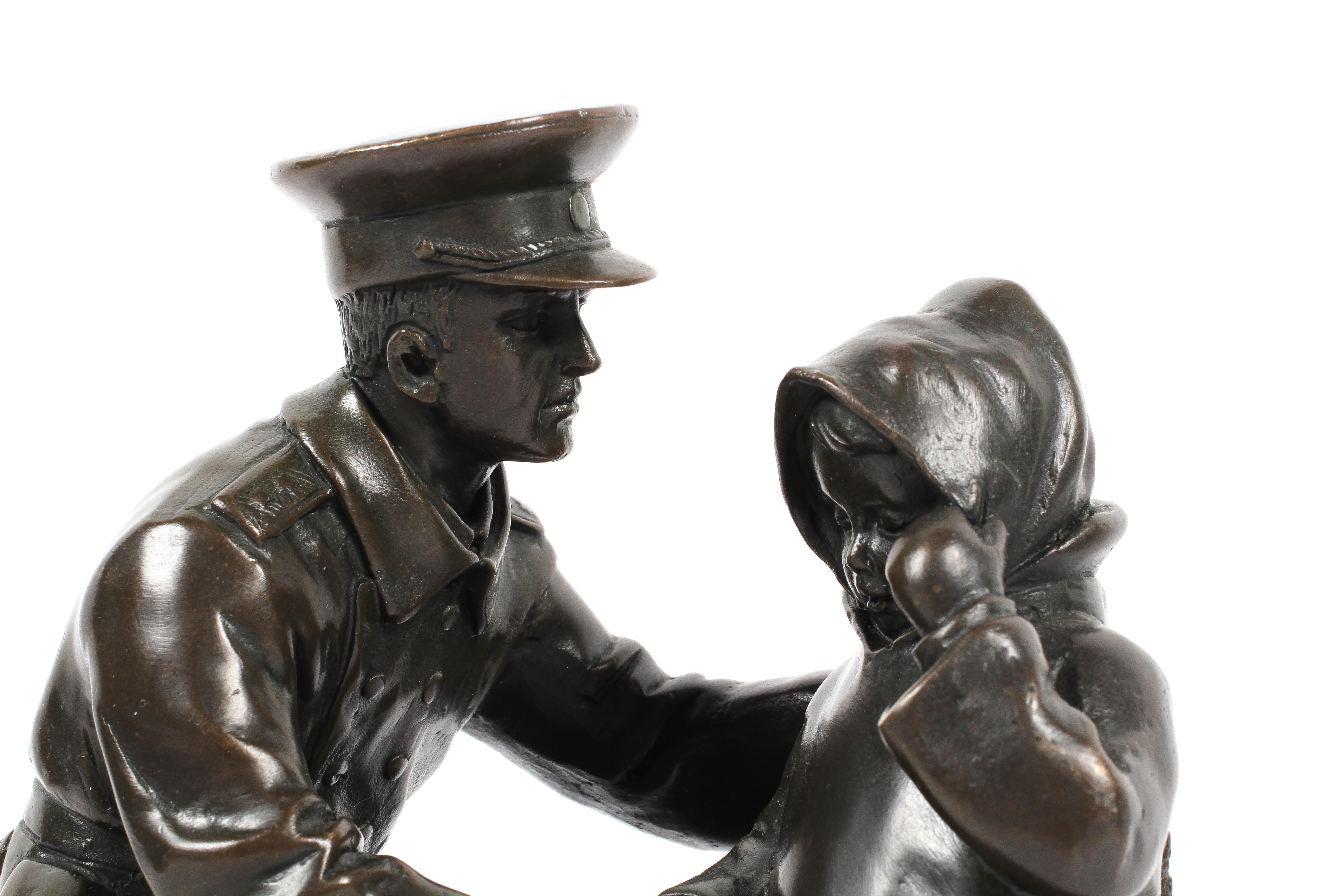 Bronze sculpture of an officer and child on a rocky mound and black marble base, - Image 2 of 3