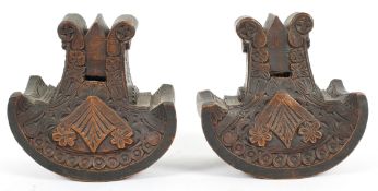 A pair of carved wooden stirrups, late 19th century, probably South American,