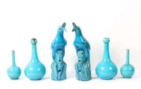 Two pairs of Burmantofts faience turquoise-glazed bottle-shaped vases and a pair of Chinese-style