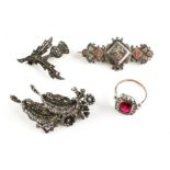 A collection of jewellery to include: Two white metal marcasite brooches;