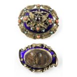 A collection of two yellow metal Victorian mourning brooches having ornate designs.