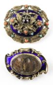 A collection of two yellow metal Victorian mourning brooches having ornate designs.