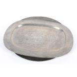 Two pewter oval platters and a charger, 18th/19th century, un-decorated,